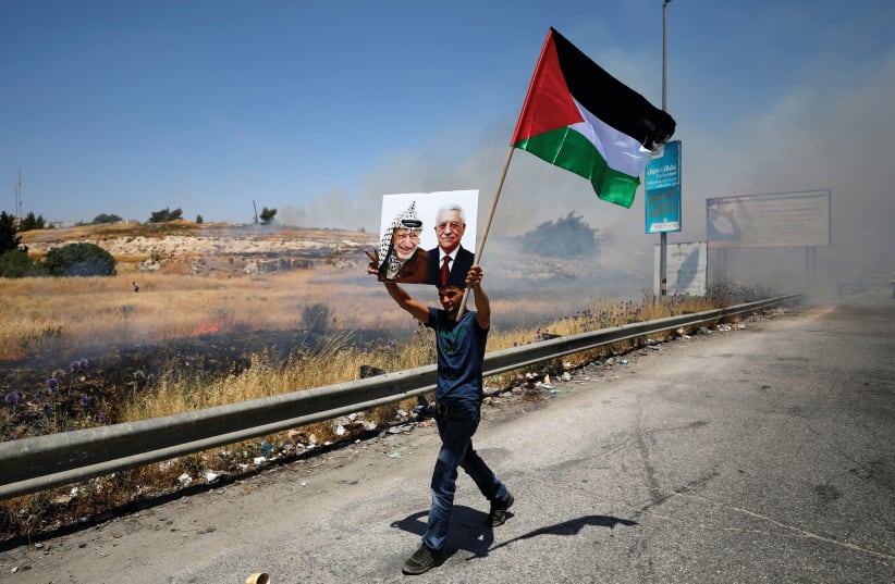 A PALESTINIAN PROTESTS the Bahrain summit (photo credit: REUTERS)