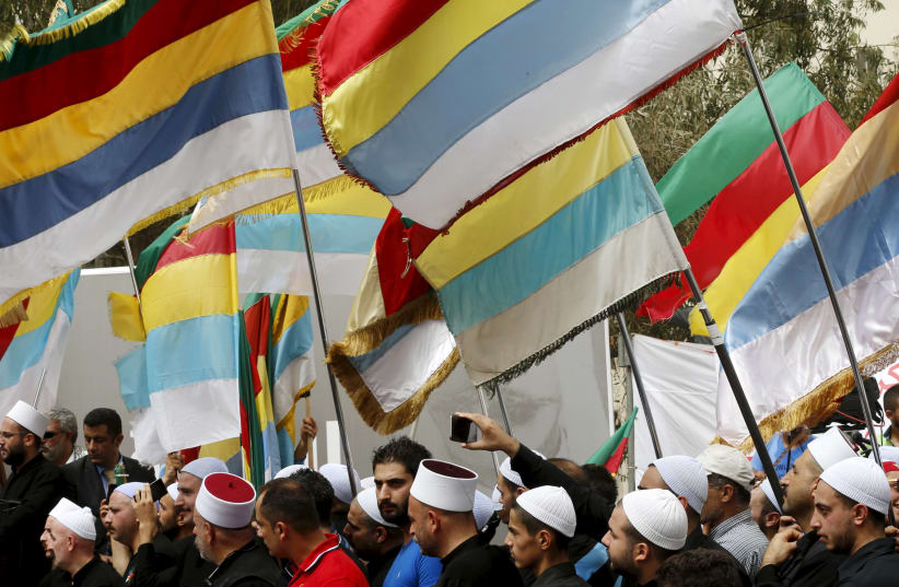 Druze Sheikhs and supporters carry Druze flags in Beirut, Lebanon, September 2015 (photo credit: MOHAMED AZAKIR / REUTERS)
