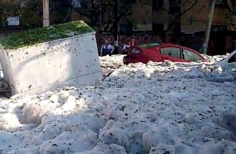 A street covered in ice is pictured after a heavy storm of rain and hail in Guadalajara, Mexico June 30, 201 (photo credit: REUTERS)
