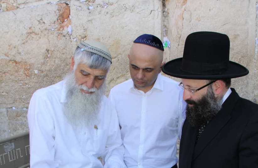Director General of the Western Wall Heritage Foundation, Mordechai Eliav [L] with British Home Secretary Sajid Javid [C] and Chief Rabbi of the Western Wall and the Holy Sites of Israel, Rabbi Shmuel Rabinowitz [R] at the Western Wall, July 1 2019  (photo credit: THE WESTERN WALL HERITAGE FOUNDATION)