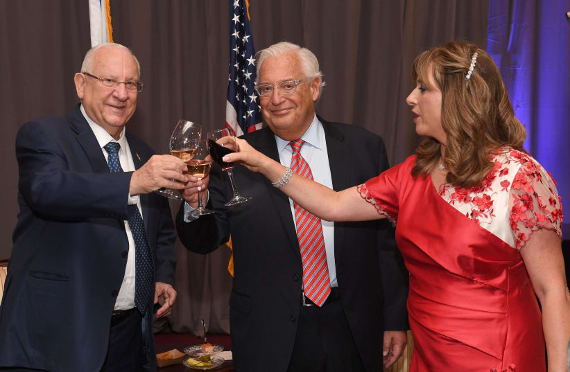 President Reuven Rivlin together with US ambsaador David Friedman and his wife Tammy raise a toast in honor of American Independence Day (photo credit: MARK NEIMAN - GPO)