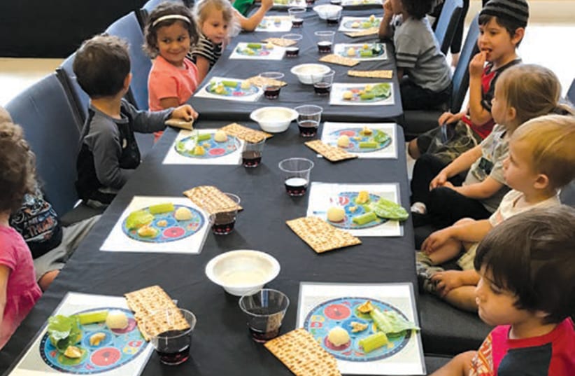 CHILDREN TAKE part in a Passover Seder. (photo credit: ROK FAMILY SHUL)