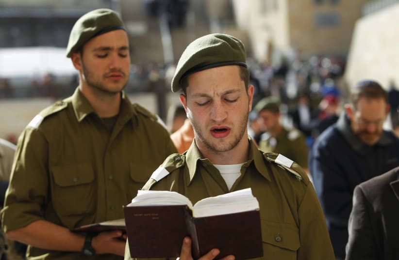 Israeli soldiers pray at the Western Wall. (photo credit: BAZ RATNER/REUTERS)
