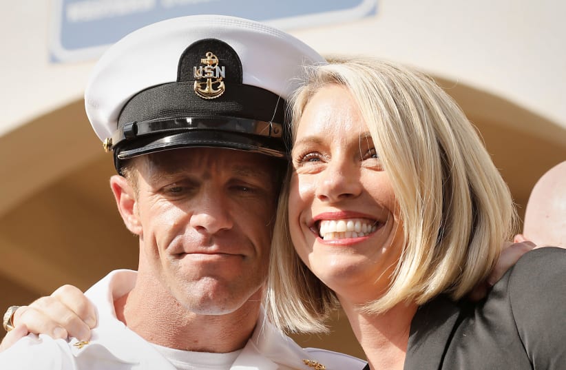 U.S. Navy SEAL Special Operations Chief Edward Gallagher, with wife Andrea Gallagher, celebrate after he was acquitted of most of the serious charges against him during his court-martial trial at Naval Base San Diego in San Diego, California , U.S., July 2, 2019 (photo credit: JOHN GASTALDO/REUTERS)