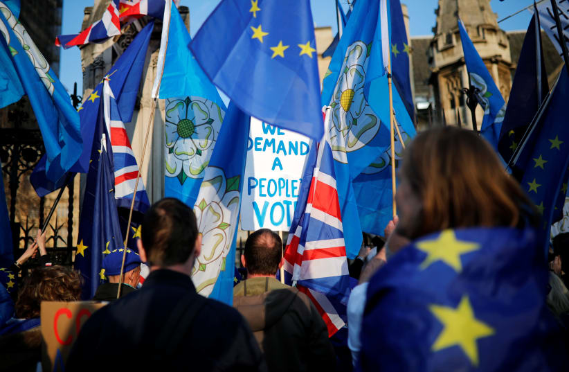 Anti-Brexit supporters protest outside the Houses of Parliament in London, Britain, April 1, 2019 (photo credit: ALKIS KONSTANTINIDIS / REUTERS)