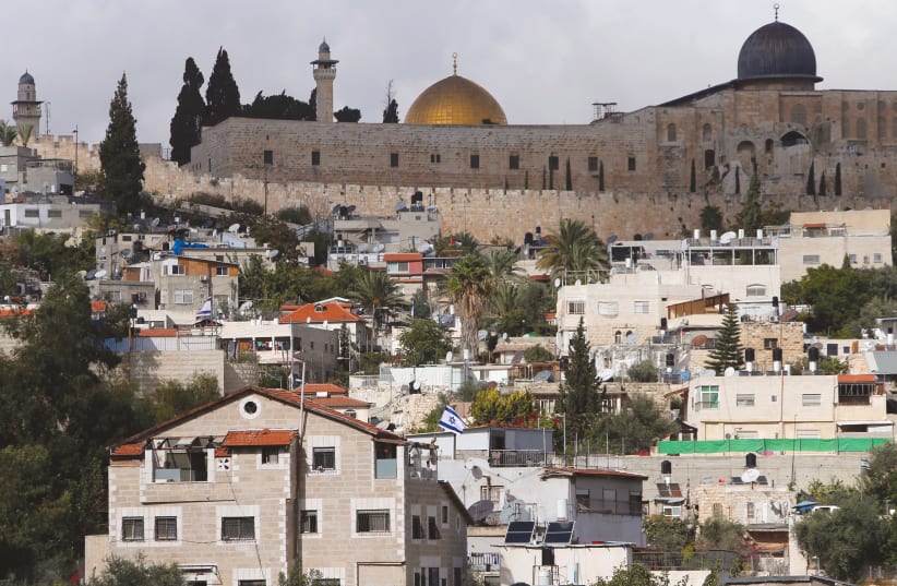 The Dome of the Rock and al-Aqsa mosque are seen from Silwan. (photo credit: REUTERS/AMMAR AWAD)