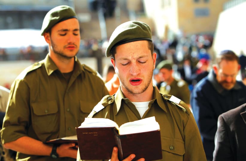 RELIGIOUS IDF soldiers pray at the Western Wall.  (photo credit: REUTERS/BAZ RATNER)