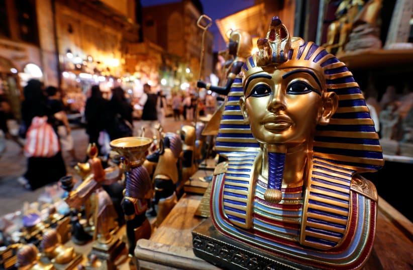 A model of Tutankhamen is displayed at a popular tourist area named "Khan el-Khalili" in the al-Hussein and Al-Azhar districts in old Islamic Cairo, Egypt, July 4, 2019. (photo credit: REUTERS/MOHAMED ABD EL GHANY)