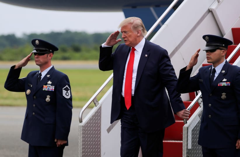 US President Trump solutes from Air Force One after arriving in New Jersey (photo credit: REUTERS/JONATHAN ERNST)