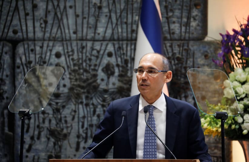 Amir Yaron speaks during a ceremony whereby he is sworn in as Bank of Israel governor by Israel's President Reuven Rivlin, in the presence of Prime Minister Benjamin Netanyahu and Finance Minister Moshe Kahlon, in Jerusalem December 24, 2018 (photo credit: AMIR COHEN/REUTERS)