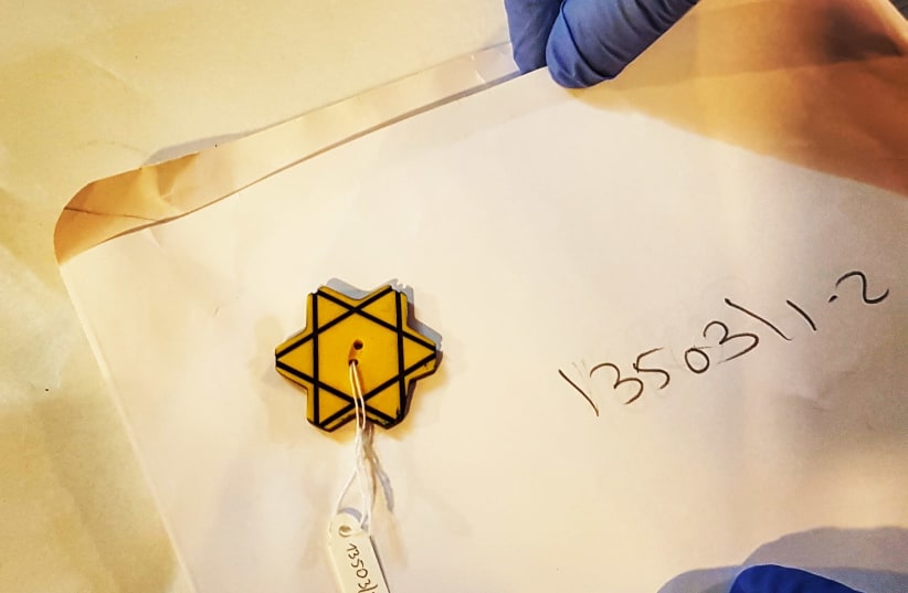 A yellow button shaped like a Star of David worn by the Jews of Bulgaria during the Holocaust (photo credit: ILANIT CHERNICK)