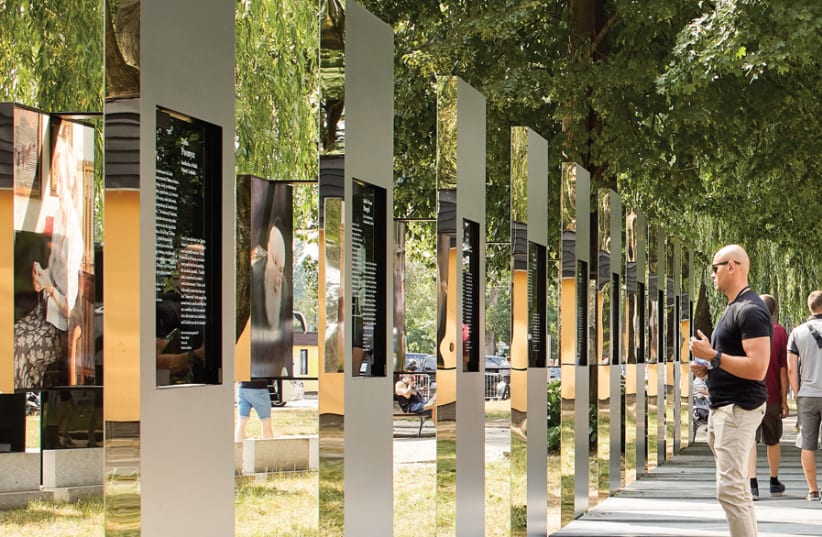 THE THROUGH the Lens of Faith installation near the entrance to the Auschwitz-Birkenau Museum invites members of the public to connect with life. (photo credit: HUFTON + CROW)