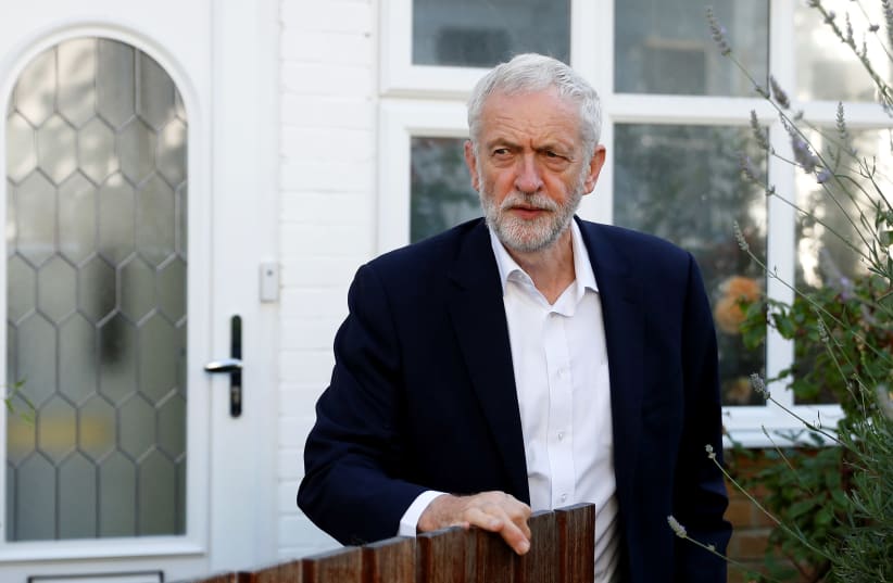 Britain's opposition Labour Party leader Jeremy Corbyn leaves his home in London, Britain earlier this month (photo credit: PETER NICHOLLS/REUTERS)