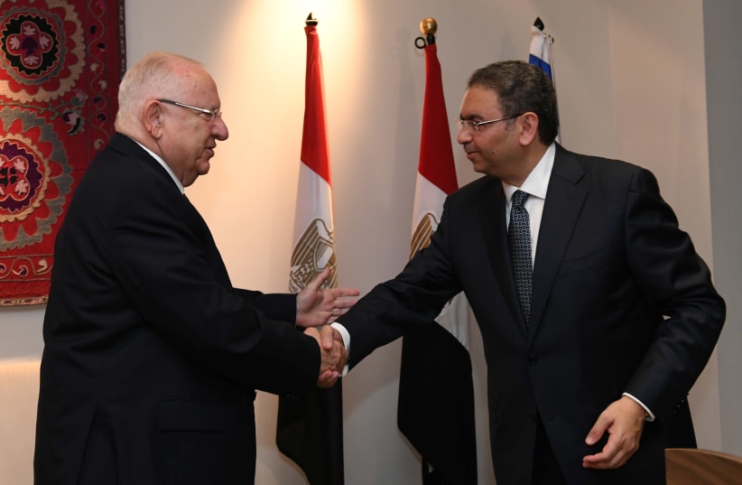 President Reuven Rivlin is welcomed by Egyptian Ambassador Khaled Azmi, July 2019 (photo credit: KOBI GIDEON/GPO)