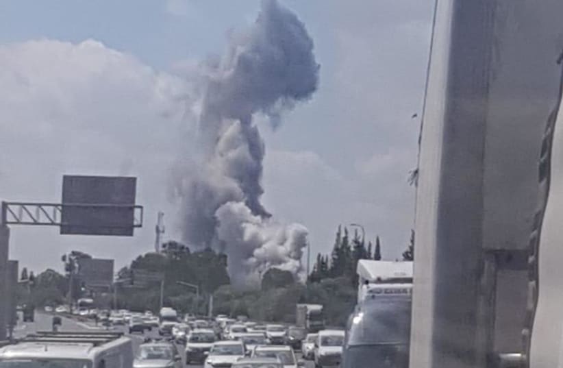 Smoke rising from an explosion at a military warehouse in Herzliya (photo credit: FIRE AND RESCUE SERVICE)