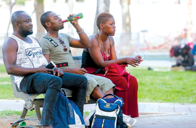 AFRICAN MIGRANTS are seen in South Tel Aviv last July. (photo credit: MARC ISRAEL SELLEM)
