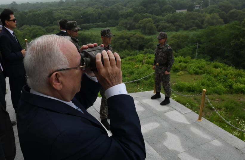 Israeli President Reuven Rivlin overlooks North Korea from the DMZ, South Korea, July 2019 (photo credit: KOBI GIDEON/GPO)