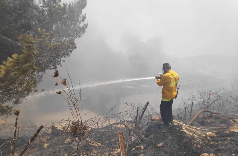 Fire and Rescue services working to put out the fire at Shavei Shomron (photo credit: MAOR LAVI/TPS)
