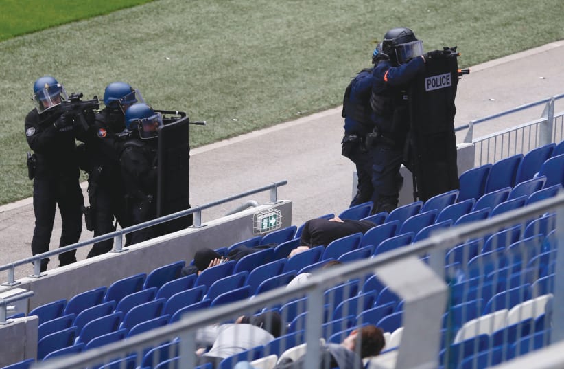 FRENCH POLICE take part in an anti-terrorism drill inside Groupama Stadium near Lyon, France, last year. (photo credit: EMMANUEL FOUDROT/ REUTERS)