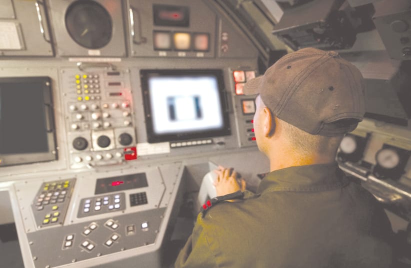 A cadet trains in a simulator of a submarine. (photo credit: IDF)