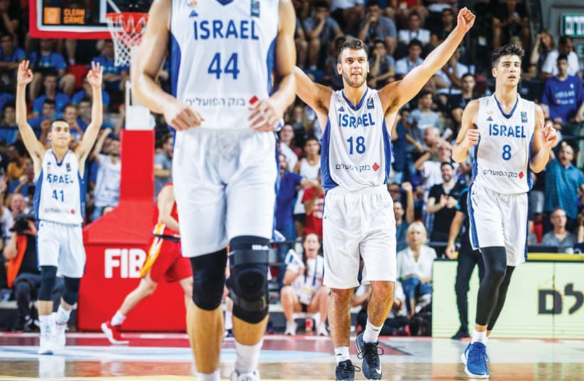 THE ISRAEL Under-20 national team celebrates after beating Spain 92-84 last night in the European Championship final in Tel Aviv to capture its second straight title (photo credit: FIBA EUROPE/ COURTESY)