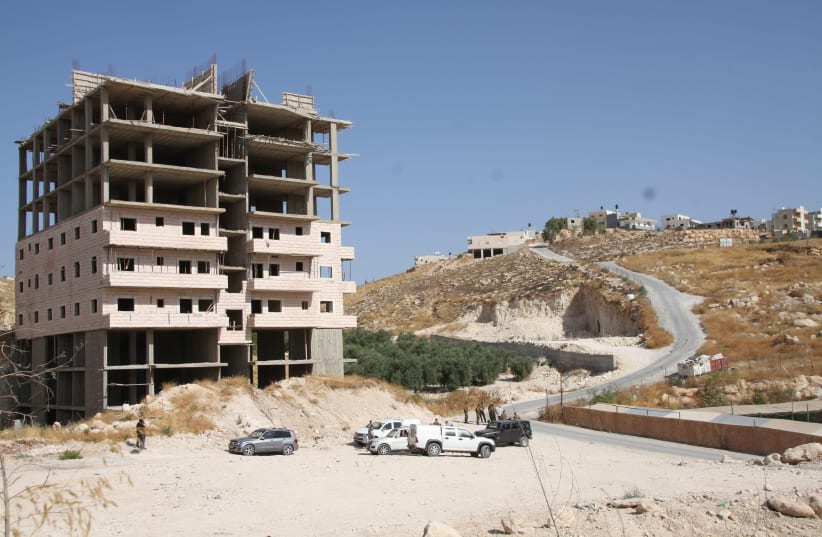 Soldiers inspected one of the Wadi Hummos structures slated for demolition on July 18, 2019. (photo credit: TOVAH LAZAROFF)