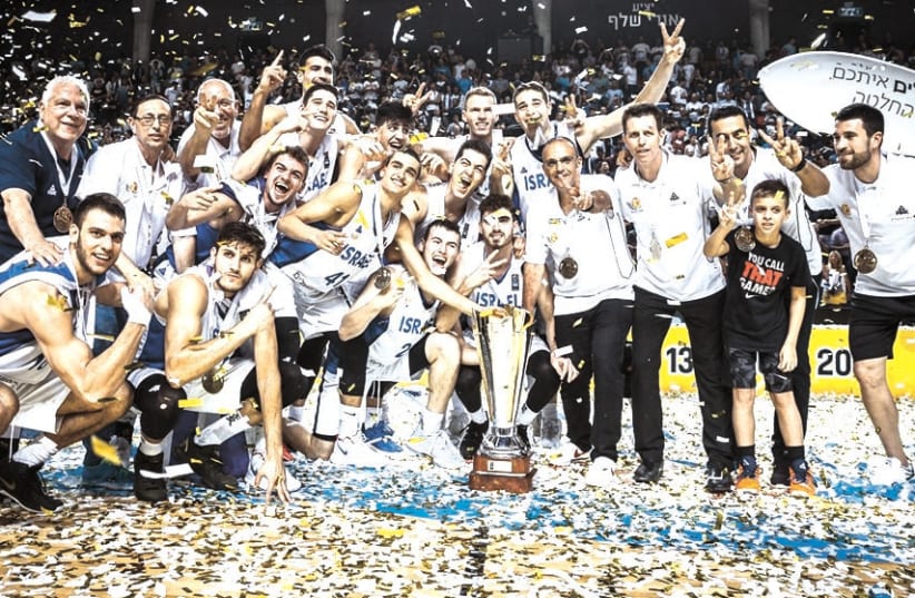THE ISRAEL Under-20 national team celebrates after beating Spain 92-84 in the final of the FIBA European Championship. (photo credit: FIBA/COURTESY)