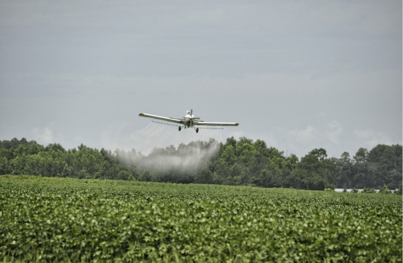 Plane releases herbicides over crops, illustrative (photo credit: PXHERE)
