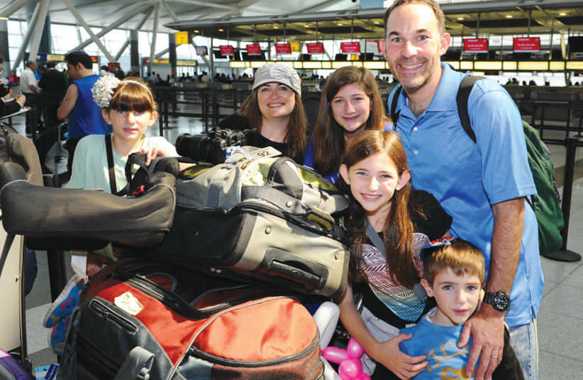 BLESSED: THE writer and her family embark on their aliyah. (photo credit: SHACHAR AZRAN NEFESH B’NEFESH)