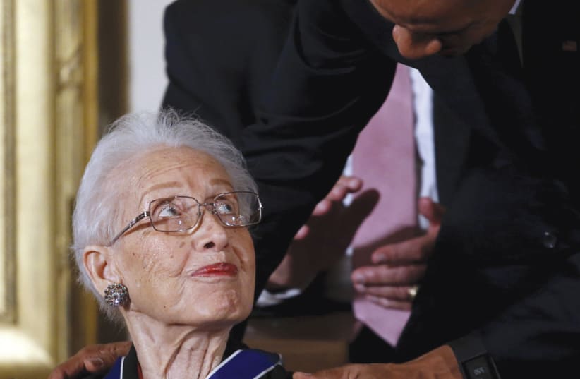 US PRESIDENT Barack Obama presents the Presidential Medal of Freedom to NASA mathematician Katherine G. Johnson in 2015. (photo credit: CARLOS BARRIA / REUTERS)