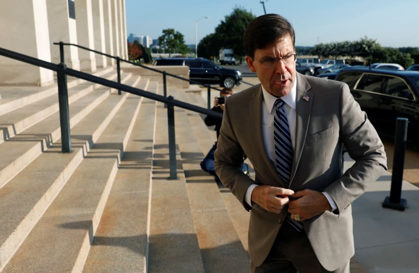 Mark Esper talks to reporters as he arrives for the first day on job as New U.S. Secretary of Defense at the Pentagon in Arlington, Virginia, U.S. July 24, 2019.  (photo credit: YURI GRIPAS / REUTERS)
