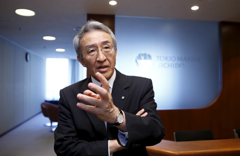 Tokio Marine Holdings Inc President and CEO Nagano speaks to Reuters' reporters at the company headquarters in Tokyo (photo credit: REUTERS)