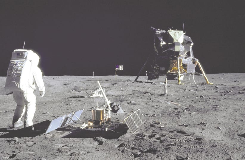 US ASTRONAUT Buzz Aldrin is pictured during the Apollo 11 extravehicular activity on the Moon, July 29, 1969. Right: Holocaust survivor and Mengele twin Eva Kor. What do they have in common?  (photo credit: REUTERS/ WIKIMEDIA)