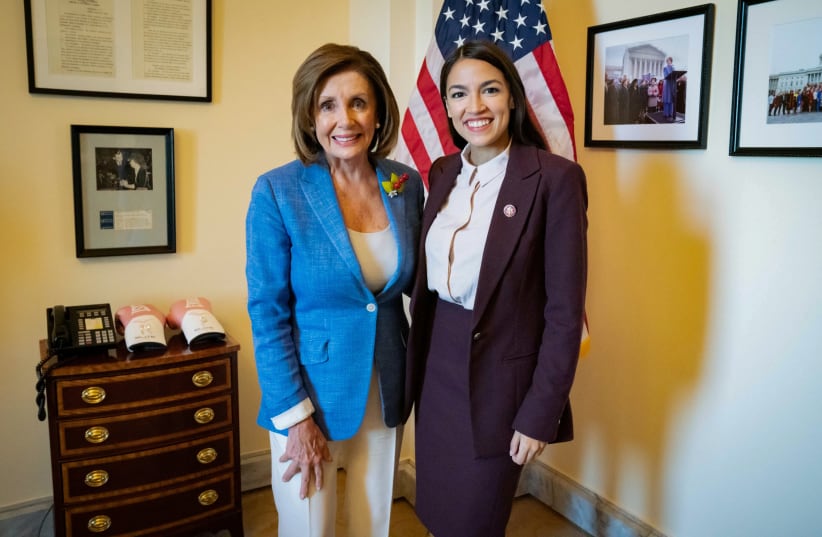 U.S. Speaker of the House Pelosi poses with Rep. Ocasio-Cortez after they met in the Speaker's office at the U.S. Capitol in Washington (photo credit: OFFICE OF HOUSE SPEAKER NANCY PELOSI)