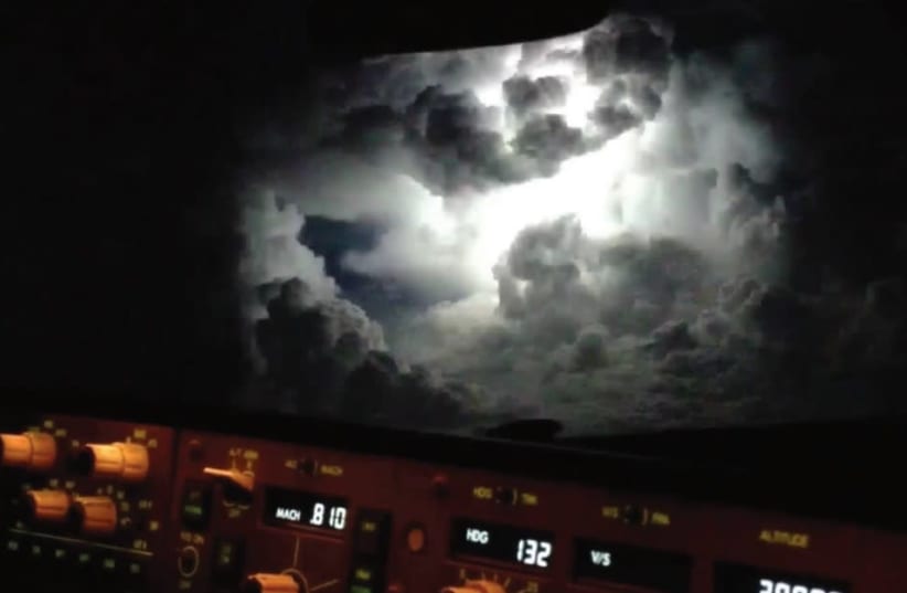 THE EXACT moment lightning explodes as seen from the cockpit of a B777 (photo credit: TOMER ZADOK)