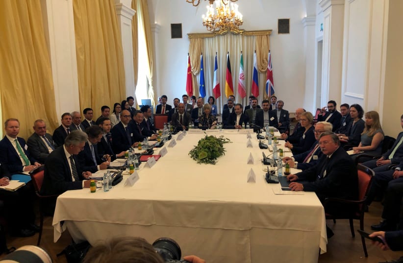 Iran's top nuclear negotiator Abbas Araqchi and EEAS Secretary General Helga Schmid attend a meeting of the JCPOA Joint Commission in Vienna, Austria to discuss the Iran nuclear deal (photo credit: REUTERS/KIRSTI KNOLLE)