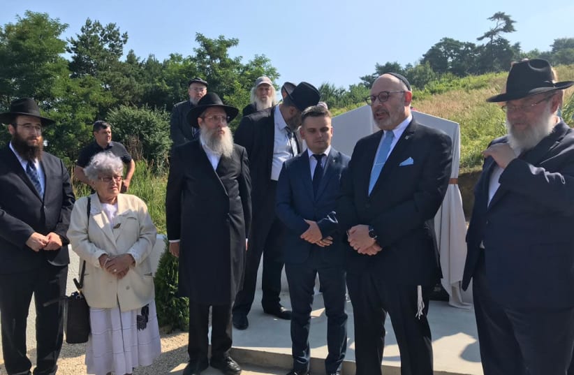 Rabbis and European Jewish leaders unveil memorial headstone for Jewish community murdered in Sadigura, Ukraine during the Holocaust.  (photo credit: RABBINICAL CENTER OF EUROPE)