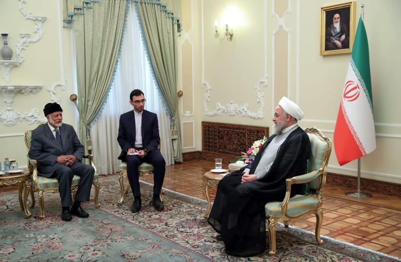 Iran's President Hassan Rouhani meets with Oman's FM Yusuf bin Alawi bin Abdullah in Tehran (photo credit: HANDOUT/REUTERS)