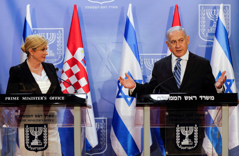 Israeli Prime Minister Benjamin Netanyahu gestures as he delivers a joint press conference with Croatia's President Kolinda Grabar-Kitarovic in Jerusalem July 29, 2019 (photo credit: MENAHEM KAHANA / REUTERS)