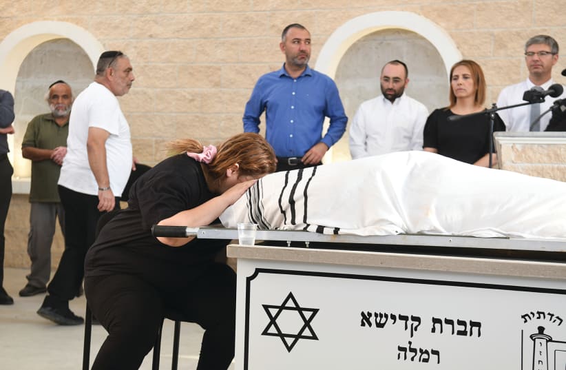 DIKLA HASDAI mourns her husband, Ofir, during his funeral at the Ramle Cemetery yesterday.  (photo credit: AVI DISHI/FLASH90)