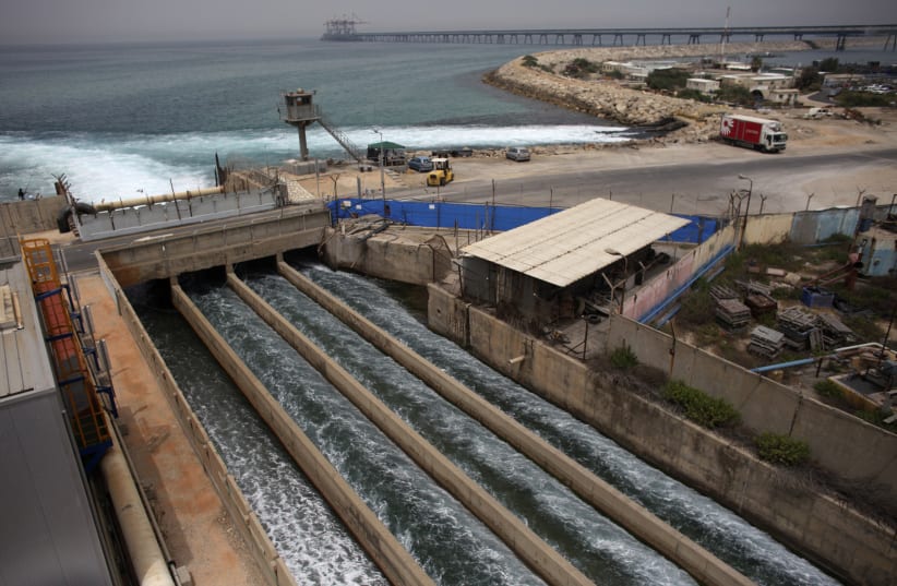Brine water flows into the Mediterranean Sea after passing through a desalination plant in the coastal city of Hadera (photo credit: NIR ELIAS / REUTERS)