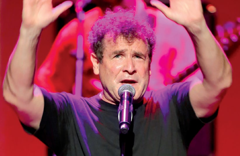 Johnny Clegg performs during the South Africa Gala night at the Monte Carlo Opera on September 29, 2012 (photo credit: SEBASTIEN NOGIER/REUTERS)
