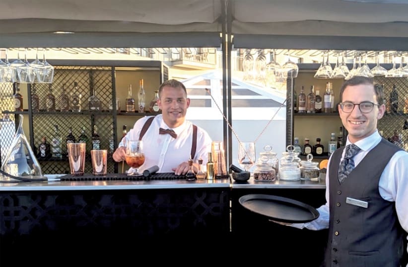 The classy bartender, Fivel, and waiter, Aviad, at the Rooftop Terrace Garden (photo credit: DAVID DIMOLFETTA)