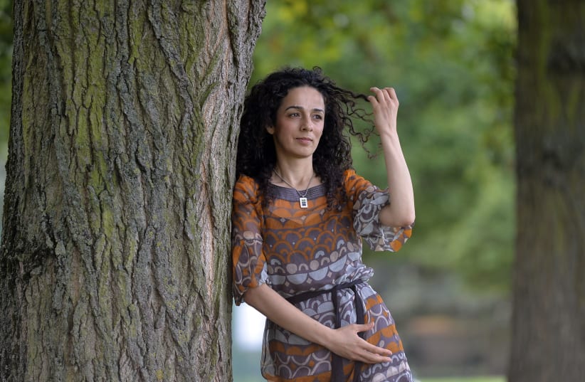 Iranian dissident Alinejad poses for a portrait in London in 2013. (photo credit: REUTERS/TOBY MELVILLE)