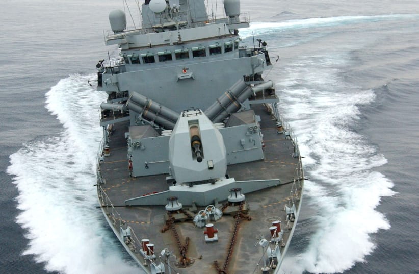 HMS Montrose performs a series of tight turns off Oman (photo credit: HANDOUT/REUTERS)