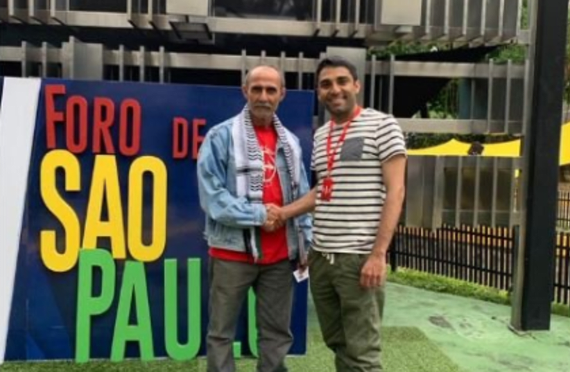A representative for the PLFP shown with BDS South Africa's Muhammed Desai (photo credit: TWITTER)