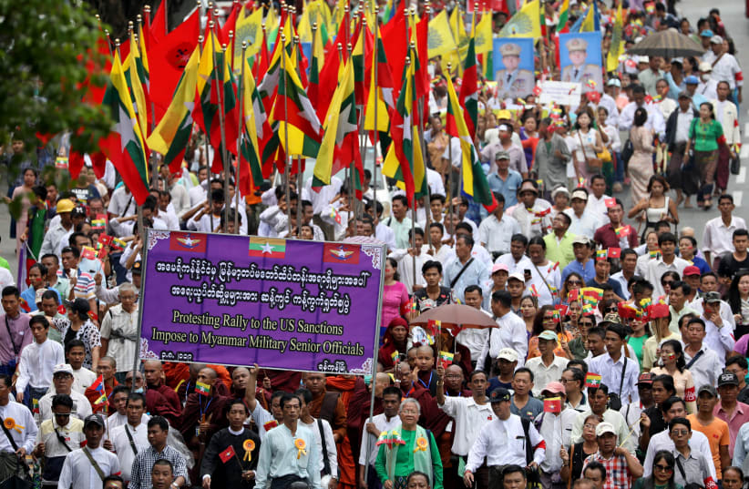 Pro-military demonstrators march to protest the U.S. sanctions imposed on Senior General Min Aung Hlaing in Yangon, Myanmar, August 3, 2019. (photo credit: REUTERS)
