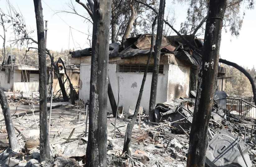 SIXTY FAMILIES found their homes and way of life destroyed when a massive fire swept Moshav Mevo Modi’im in late May. (photo credit: ELDAD MAESTRO)