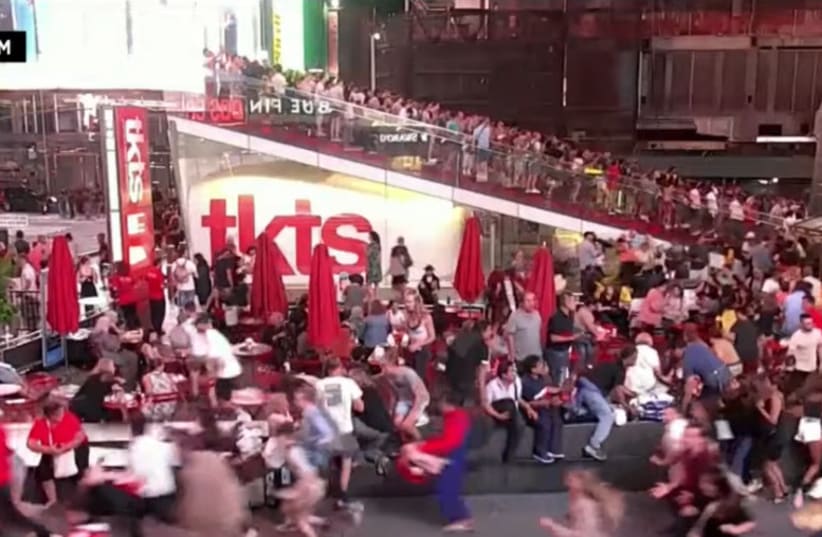 Stampede in New York City's Times Square as people confuse motorcycle with gunshots (photo credit: screenshot)