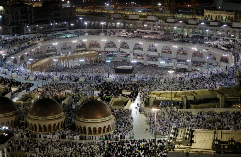 Muslims pray at the Grand Mosque during the annual Haj pilgrimage in the holy city of Mecca, Saudi Arabia August 6, 2019 (photo credit: UMIT BEKTAS / REUTERS)